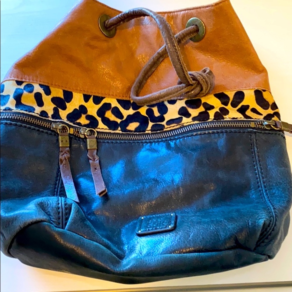 Black, dark tan and leopard backpack hardly used